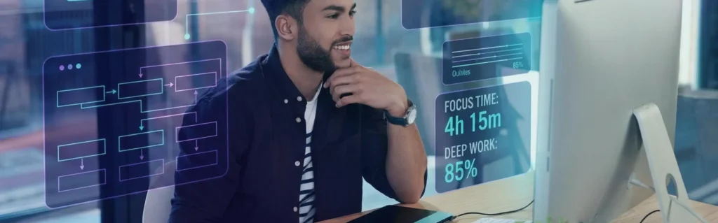 Engineer working comfortably in a bright hybrid workspace, showing a calm and productive work environment.